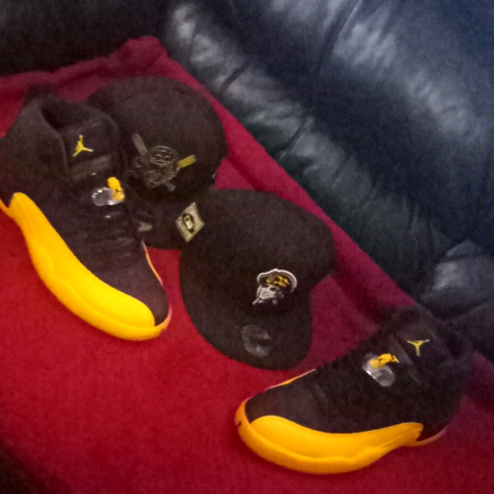 Black and university gold jordan retro 12